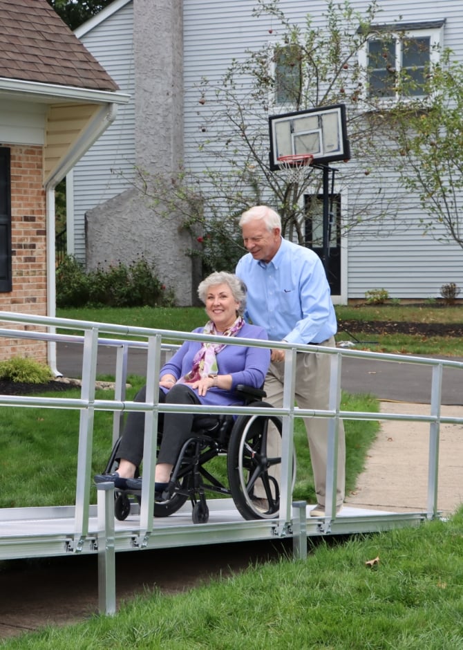 ADA Ramp Guidelines for the Elderly - Man Pushing Disabled Wife in Wheelchair