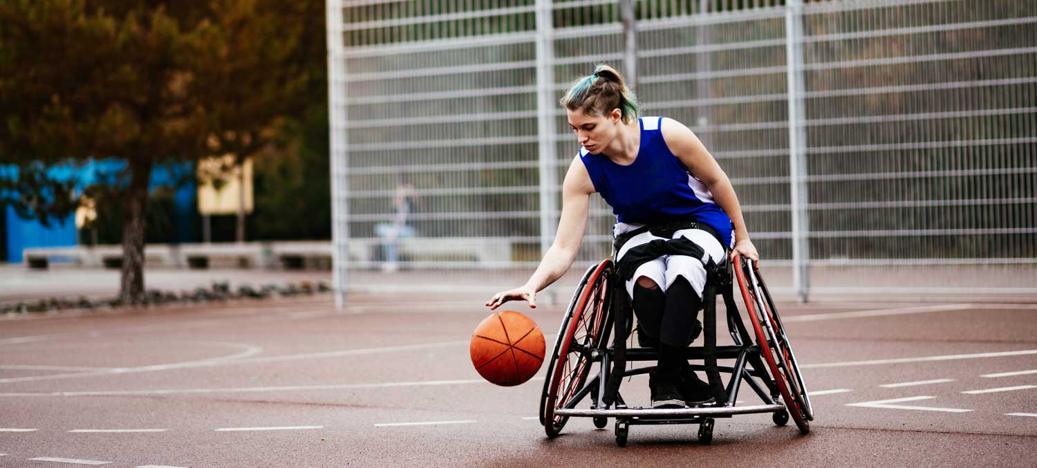 Disabled Lady in a Wheelchair Playing Adaptive Basketball