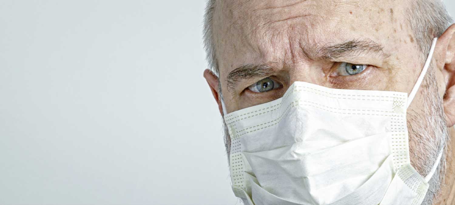 Close up of an elderly man wearing a face mask