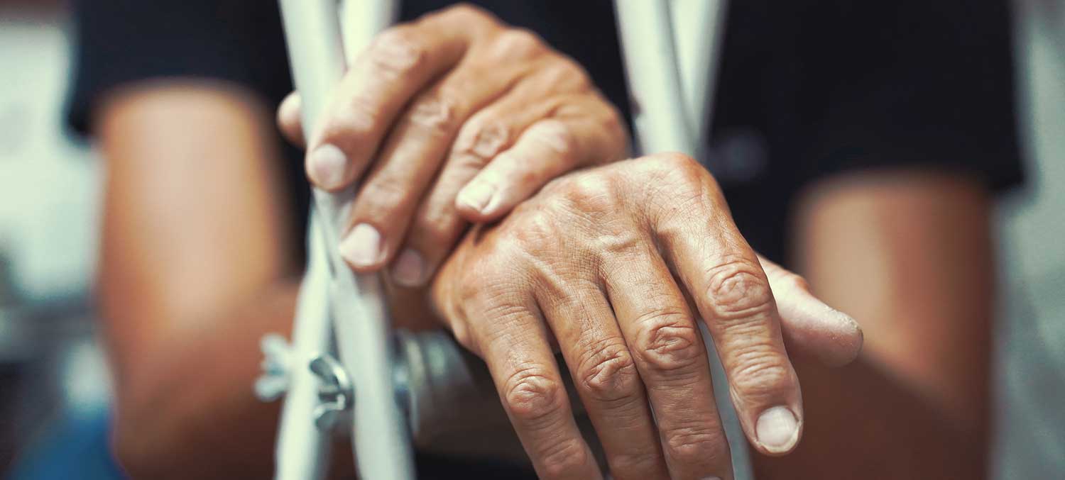 Man's Hands on Crutches - Safe at Home Recovery