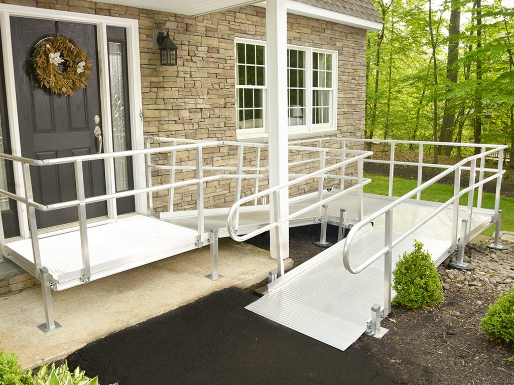 Liberty Series Solid-Deck Aluminum Access Ramp Outside a Front Door of a Home